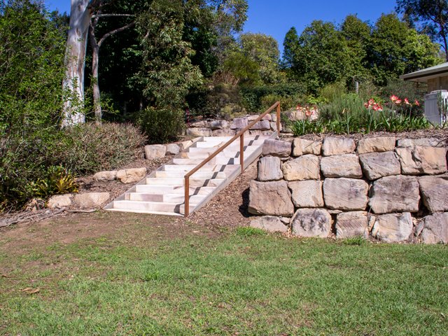 Random sandstone boulder wall with diamond sawn sandstone steps